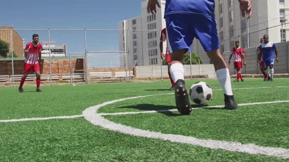 Soccer players having match on field