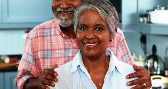 Senior couple standing in kitchen