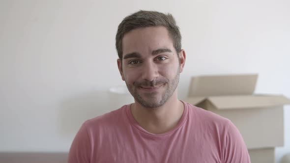 Closeup Portrait of Attractive Young Man Posing in Living Room