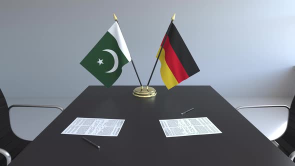 Flags of Pakistan and Germany on the Table