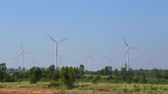 4k timelapse of Wind turbine producing alternative energy with blue sky