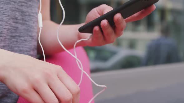 Caucasian woman listening to music with headphones