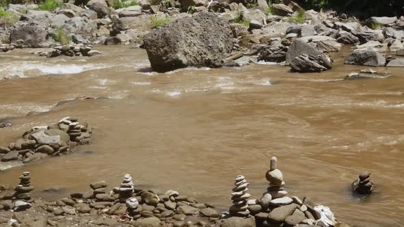 Flowing mountain river between rocks.