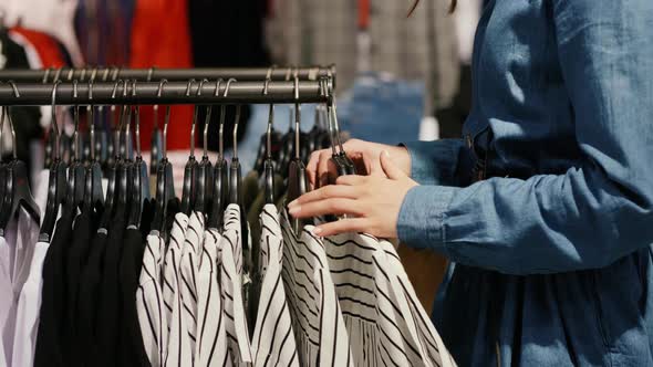 Young woman in the clothes shop