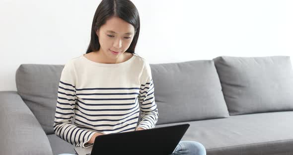 Woman use of notebook computer at home