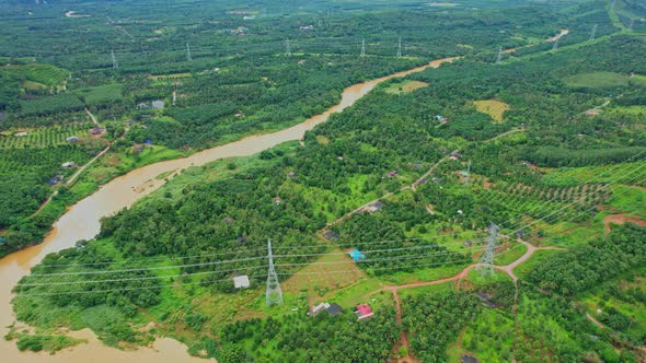 4K : Aerial view over farmland and hill farming