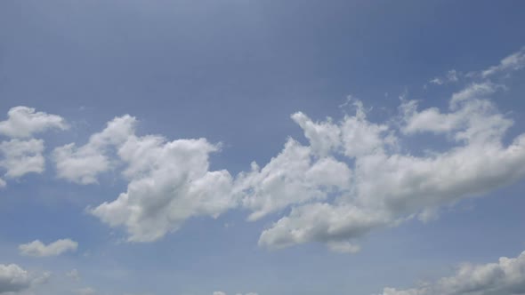 Time lapse of white cloud moving pass around sky background