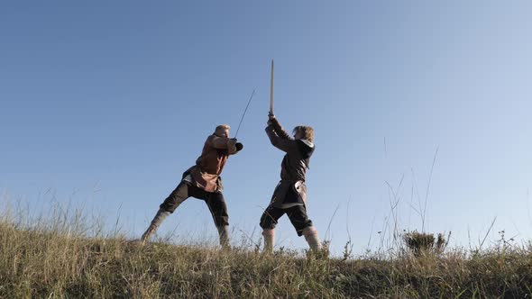 Medieval warriors fighting on a hilltop