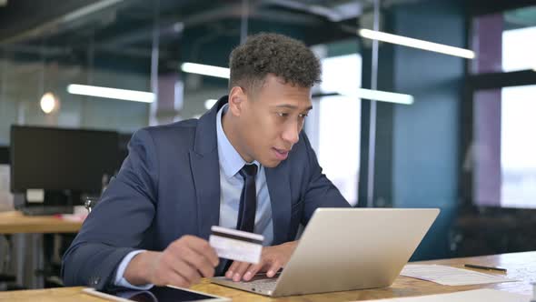 Young Businessman Making Online Payment Success on Laptop