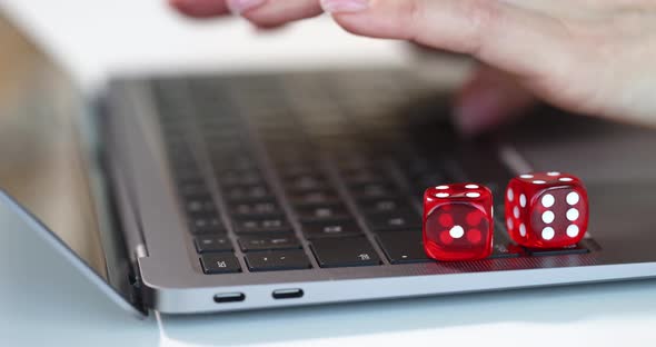 Woman Hands Typing on Laptop Keyboard Near Dice Closeup  Movie