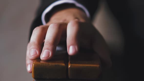 businessman hand taps armchair armrest by finger closeup