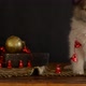 Little Puppy Plays with Christmas Decorations Lying on an Antique Dresser - VideoHive Item for Sale