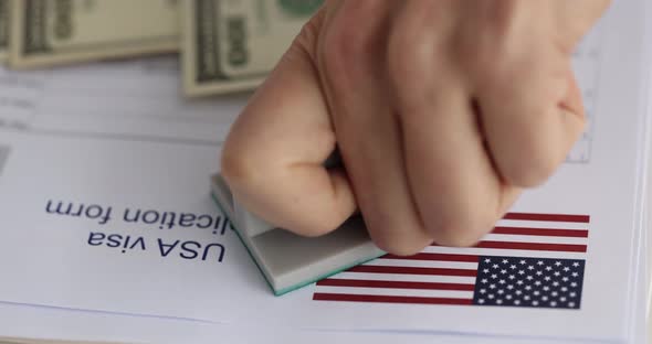 Hand Putting Stamp Approved on Documents for Obtaining American Visa Closeup  Movie