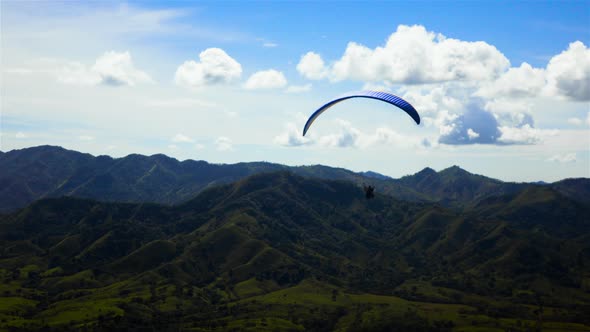 People Riding and Flying Paramotor Flying in the Sky Mountains