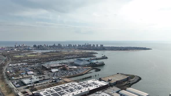 A high angle view above Shore Parkway and a new high-rise construction site in Brooklyn, NY. The dro