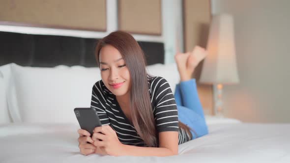 Young asian woman use smart phone