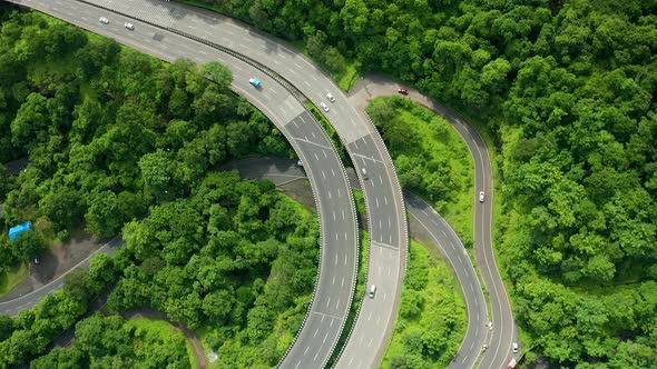 flyby over a Highway passing through the forest in the western ghats of India