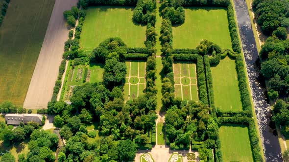 Beautiful avenue of trees of Nieborow Palace, a Baroque style residence in Poland. Colourful foliage