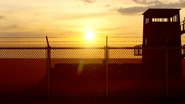 Soldier Watching the Military Watchtower and Sunset View