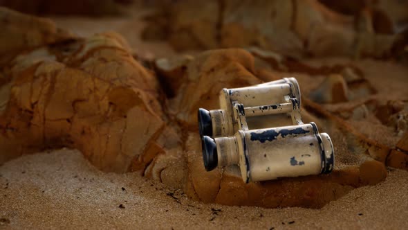 Old German Military Binoculars on the Sand Beach alt