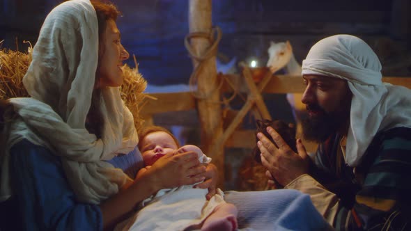 Joseph with Lamb and Mary with Baby Jesus in Stable