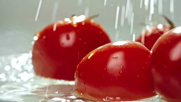 Large Ripe Tomatoes Under Cool Running Water