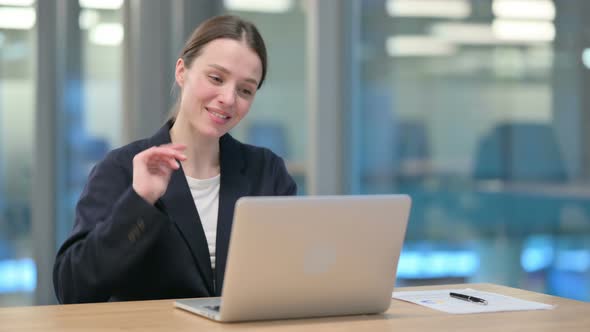 Young Businesswoman Talking on Video Call on Laptop 