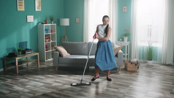 Woman Is Dancing with Mop at Home