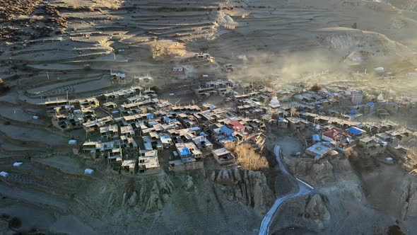 Aerial view looking down at Manang and terraces above the village