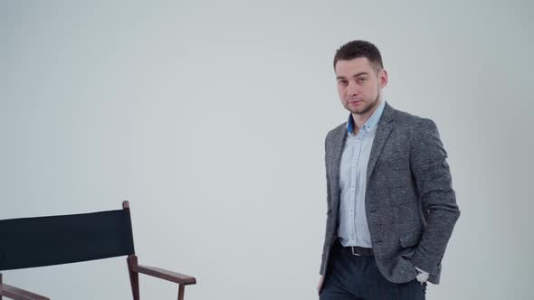 Portrait of a stylish man in suit in studio