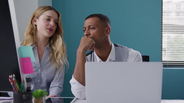 Man and woman discussing at the office