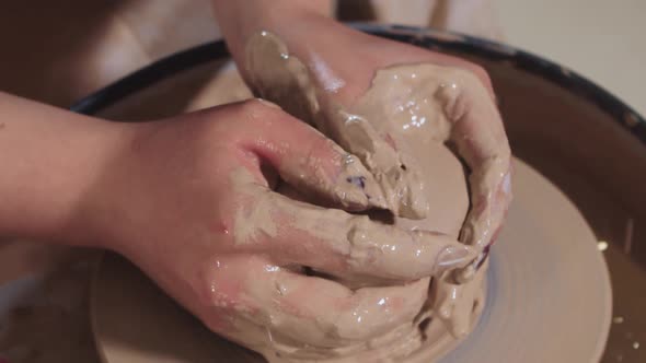 Pottery Crafting Woman Hands Forming Wet Clay From Longer Shape to Shorter and More Plump Making It