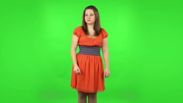 Angry Girl Is Scolding, Shaking Her Index Finger and Threatening with a Fist