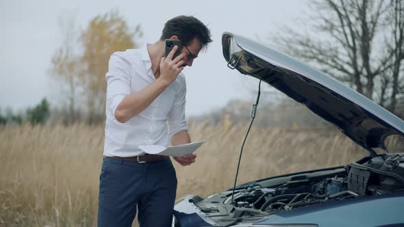 Broken Car Leaks Engine Coolant. Man Fixing Engine Overheating On Car. Driver Road Problem With Auto