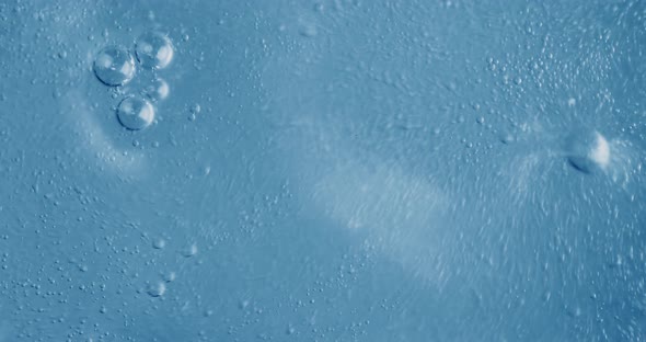 Oxygen Bubbles in Water on a Blue Abstract Background