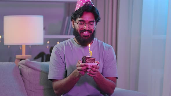 Home Party Happy Arabic Indian Bearded Man in Glasses with Hat Holding Birthday Cake Slice with