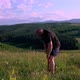 Man training outdoors. Sunset, over green hill - VideoHive Item for Sale