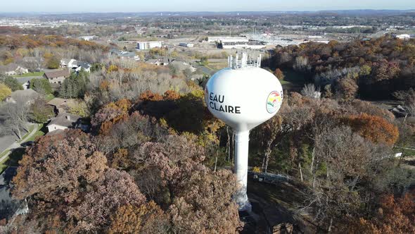 Aerial view of Eau Claire, Wisconsin, water tower in autumn with surrounding residential area.