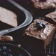 Composition of Fresh Homemade Chocolate Brownie Squares Melting Chocolate and Fresh Blueberries - VideoHive Item for Sale