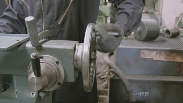 Hand of engineer man operating using industrial machine in factory.