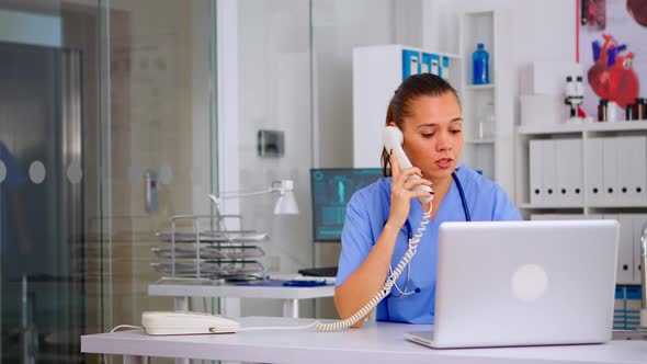 Medical Staff Talking with Patient on Phone