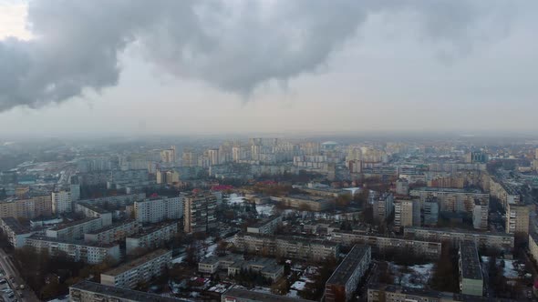 White Smoke on the Background of the Evening City Panorama