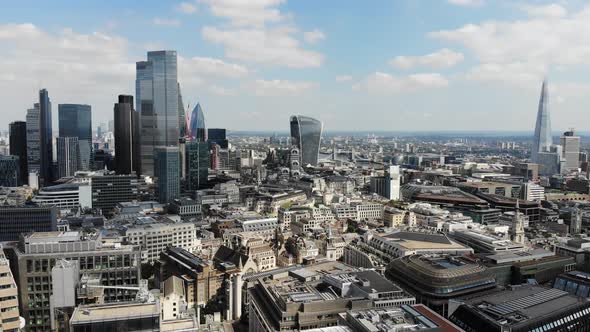 Reverse aerial view of London Financial and Banking district with Canary Wharf in the background