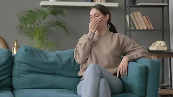 Woman Coughing While Sitting on Sofa