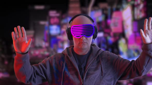 Man in Futuristic Glasses and Headphones Swaying Hands in Night City