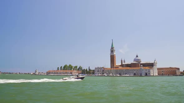 Motorboat Sailing Near Beautiful San Giorgio Maggiore Island in Venice, Tourism