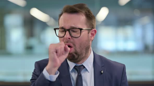 Portrait of Sick Middle Aged Businessman Coughing