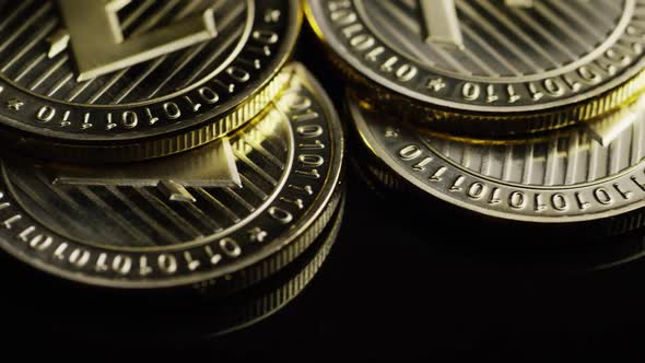 Rotating shot of Bitcoins (digital cryptocurrency) - BITCOIN LITECOIN 247