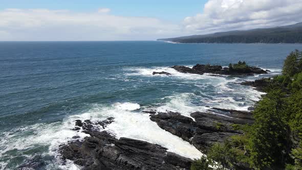 4k drone footage of curved flight over Vancouver Island's gruff and wild west coast shoreline. Big w