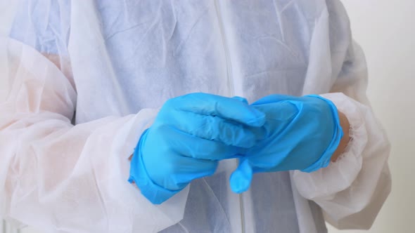 The Doctor Removes Gloves From His Hands After a Serious Operation and Saving the Patient's Life